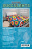 A large Oversized hexagon quilt is shown on the cover of this quilt pattern and features subtle , garden hues of greens, neutrals and peachy tones. - Image 2 of 0