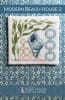 MODERN BEACHHOUSE 2 Cross Stitch Pattern shows a modern coastal beach design witha shell and seaweed and graphic rings. - Image 1 of 0