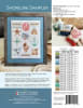 Shoreline SamplerCross Stitch Pattern by Robin Pickens shows a display of seashells, coral, a star fish , an anchor, and sandpipers, a compass and mariner's rope. - Image 2 of 0