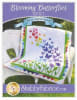 Blooming Butterflies Pattern by Shabby Fabrics shows an array of butterflies in bright colors on a white background with a pretty green border. - Image 1 of 0