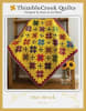 Star Struck Quilt Pattern by Thimble Creek shows a bright quilt featuring star blocks in many colors on a bright cheddar ground. - Image 1 of 0