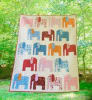 The cover shows a quilt with sphere like shapes that are created thru color placement in simple pieced blocks, with a very modern vibe. - Image 3 of 0