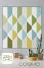 COSMO Quilt Pattern by Zen Chic shows a simple quilt , with straight lines and not much piecing, in shades of olive, blue and cream. - Image 1 of 0