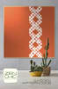 A ribbon of huge scrappy crosses is the eyecatcher of this easy to sew cozy lap-size quilt in pretty spicy orange. - Image 1 of 0