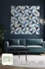 This cover shows a quilt in shades of light to dark blue and whites, with curved pieced blocks in a modern quilt block and design. - Image 1 of 0