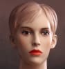 Female mannequin in flesh tone with realistic facial features. She has molded hair and earring holes. Shop all of our realistic female mannequins at www.zingdisplay.com - Image 2 of 0