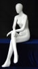 Glossy white female seated egghead mannequin made of fiberglass in a natural sitting pose with no base. - Image 2 of 0