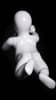 Glossy white toddler mannequin with abstract egghead in a belly-down laying pose for retail display. - Image 2 of 0