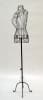 Black female metal wire dress form standing on an antique metal base for retail garment display. - Image 2 of 0
