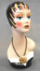 Vintage style hand-painted fiberglass female display head with colorful artistic makeup and integrated base for retail accessory merchandising. - Image 1 of 0