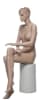 Seated realistic female mannequin with molded hair, light flesh tone finish, and hand-painted facial features for apparel displays - Image 3 of 0