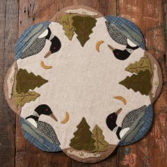 LOON WOOL MAT PATTERN from Buttermilk Basin shows a pretty mat featuring Loons around the mat.