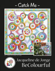 Catch Me Quilt Pattern by BeColourfulshows a picture of a multicolor quilt with rings of stars in various sizes.