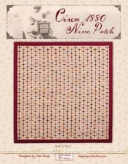 Circa 1880 Nine Patch Quilt Pattern  shows a scrappy quilt in many colors on a neutral background.