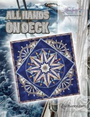 ALL HANDS ON DECK Quilt Pattern by Judy Niemeyer shows a dark navy mariners compass quilt.