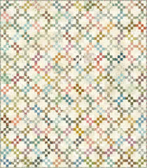 Confidence Quilt Pattern by Laundry Basket Quilts shows a modern quilt made with very small blocks, on the diagonal, with scrappy pieced square in a square blocks.