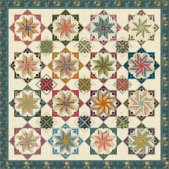 Eldon  Dahlia Quilt Pattern by Edyta Sitar, Laundry Basket Quilts shows a pieced quilt, in muted colors of teals, blues,  plums, golds, reds and beige.