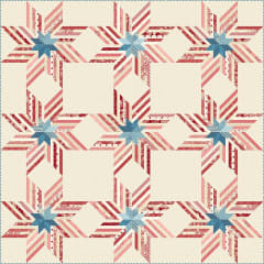 Freedom Star Quilt Pattern by Laundry Basket Quilts shows a modern, graphic star quilt in red, white and blue.