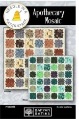 Colorful quilt with an appliqued mosaic motif on a contrasting design repeated across the quilt top.