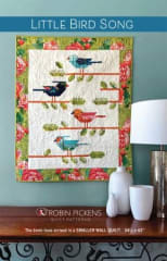 Little Bird Song Quilt Patternby Robin Pickens shows a fall wall hanging featuring 4 Acorns and shows the quilt made with a dark background as well as one made with a light background.