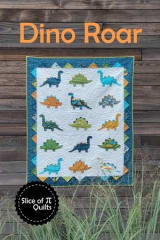 The photo shows the quilt pattern cover with 15 dinosaurs in a vaqriety of bright colors set on a white ground and has dino spikes made from prarie points.