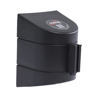 WALLPRO 450 heavy-duty wall mount retractable belt barrier in safety orange housing with the 20-foot black and yellow striped belt fully extended across a wide warehouse loading dock entrance.