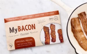 My Bacon plant based bacon strips cooked until crispy in a skillet