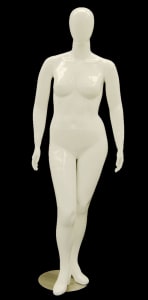 Abstract egg head Nancy female mannequin in a white finish standing on a round glass base with metal support rods.