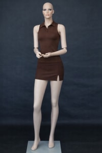 Realistic fiberglass female mannequin with movable bendable elbows, skin-tone finish, sculpted face, hand-painted makeup, and a heavy-duty glass base.