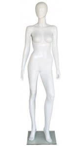 Gloss white fiberglass female egghead mannequin in an abstract standing pose with a raised knee, mounted on a tempered glass base, used for high-end clothing displays.
