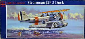 Box Art of amphibious plane, J2F-2 Grumman Duck skimming the water line.