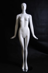 Elegant standing female abstract mannequin in glossy white fiberglass with a round metal base.