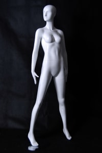 Tall standing female abstract mannequin in glossy white fiberglass with a durable metal base.