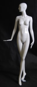 Tall standing female abstract mannequin in a glossy white fiberglass finish with a durable metal base.