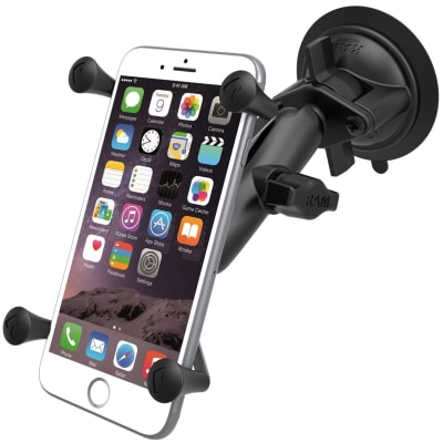 RAM X-Grip suction cup phone mount with adjustable arm and spring-loaded â€˜Xâ€™ holder, securing a large smartphone on a vehicle windshield.