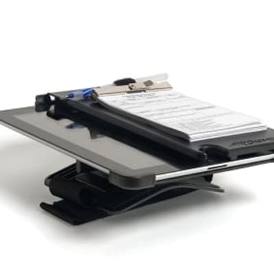 Pilot using AirGizmos iPad Knee Dock in cockpit with adjustable angle and fold-over tablet holder for charts and notes.