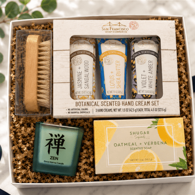 Luxury spa gift tray featuring Mistral French soap, botanical hand creams and an artisan candle. Elegant wellness gifts delivered nationwide