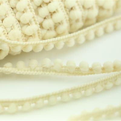 Ivory Baby Pom Trim