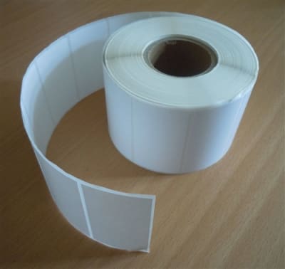 White industrial direct thermal labels with perforation, 3" core, 5,100 labels per roll, 8 rolls per case.