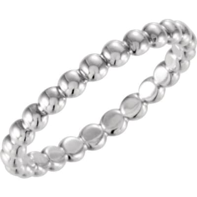 This beaded 14k stackable ring features delicate beads of gold woven together.