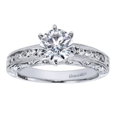 Well designed and beautifully styled, this vintage style straight engagement ring has a flair for the dramatic with 1/3 carats in round diamonds, available in white gold or platinum.