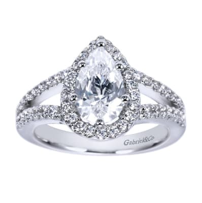 Platinum bands come together to form a pear shaped halo in this platinum split shank pear diamond halo engagement ring.