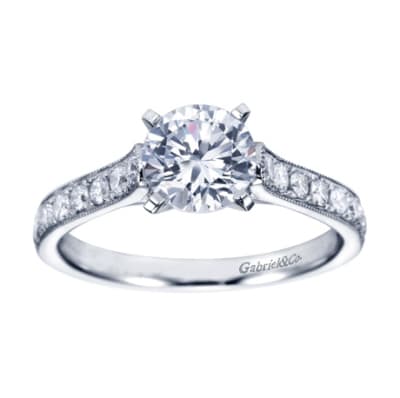White gold and round diamonds mix spectacularly to form this vintage straight engagement ring available in white gold or platinum, featuring over 1/3 carat in diamonds.
