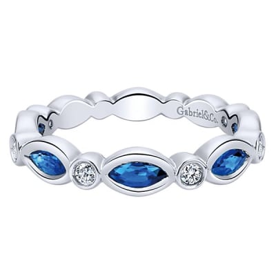This 14k white gold diamond stackable ring features sapphires and diamonds.