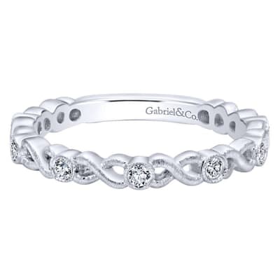 This 14k white gold diamond infinity stackable ring boasts round brilliant diamonds.