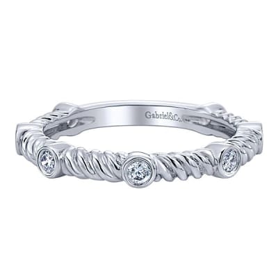 This delicate diamond roped stackable ring features nearly one quarter carats of diamonds.