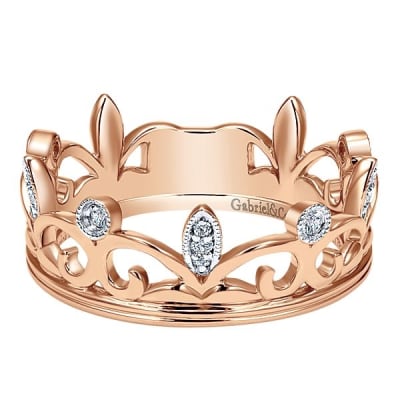 This 14k rose gold diamond stackable ring is fashioned like a crown.