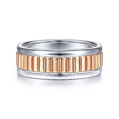 This 14k rose and white gold men's wedding band is 8mm wide and features a ridged center section.
