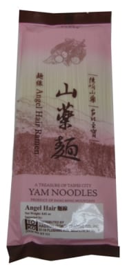 A bowl of yam noodles angel hair, served with vegetables and a savory sauce for a healthy plant-based meal