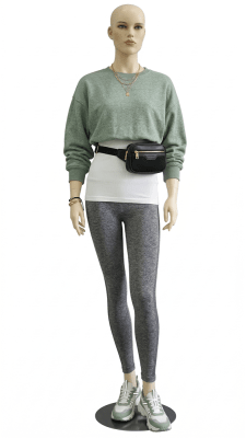 flesh tone female mannequin with realistic makeup and arms at sides